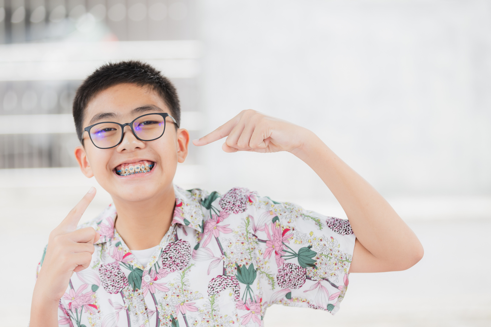 Young man or boy smile with teeth brace dental for healthy or medical background.